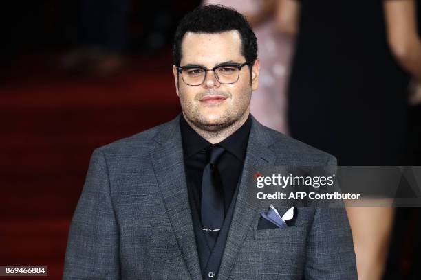 Actor Josh Gad poses upon arrival to attend the world premiere of the film 'Murder on the Orient Express' at the Royal Albert Hall in west London on...