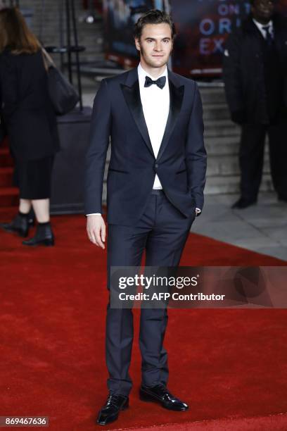 British actor Tom Bateman poses upon arrival to attend the world premiere of the film 'Murder on the Orient Express' at the Royal Albert Hall in west...