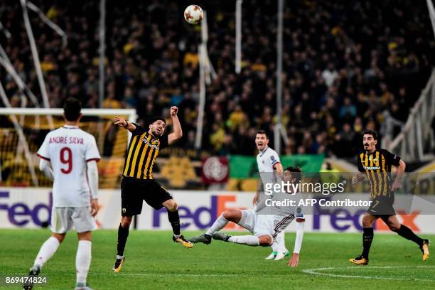 Milan's Manuel Locatelli vies for the ball with AEK's Tasos Bakasetas during the UEFA Europa League Group D football match between AEK Athens and AC...