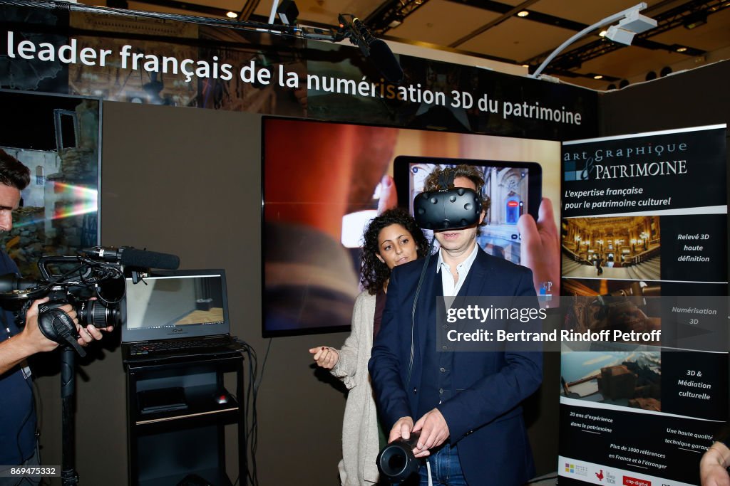 Stephane Bern Visits The "International Exhibition Of Cultural Heritage - Salon International Du Patrimoine Culturel" At Carrousel Du Louvre In Paris