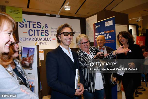 Stephane Bern trying 3D glasses during the Official Visit of Stephane Bern at the "International Exhibition of Cultural Heritage - Salon...