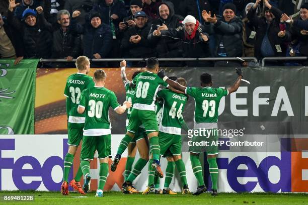 Ludogorets' Brazilian midfielder Marcelinho celebrates with teammates after scoring a goal during the Europa League football match PFC Ludogorets...