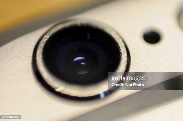 The camera optics on the back of an iPhone 6s are seen on November 2, 2017.