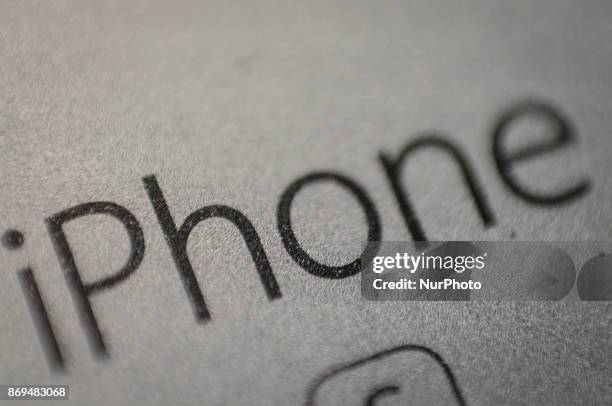 The word iPhone is seen on the back of an iPhone 6s on November 2, 2017.