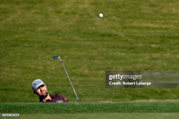 Ryan Moore hits from a green side bunker on the third hole during the first round of the Shriners Hospitals For Children Open at TPC Summerlin on...