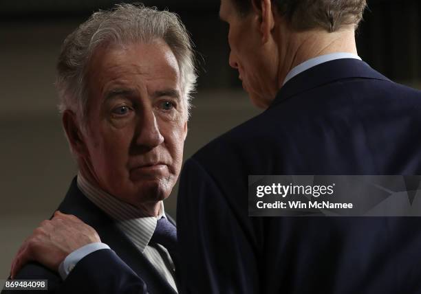 House Ways and Means ranking member Richard Neal confers with Sen. Ron Wyden during a press conference where congressional Democrats reacted to the...