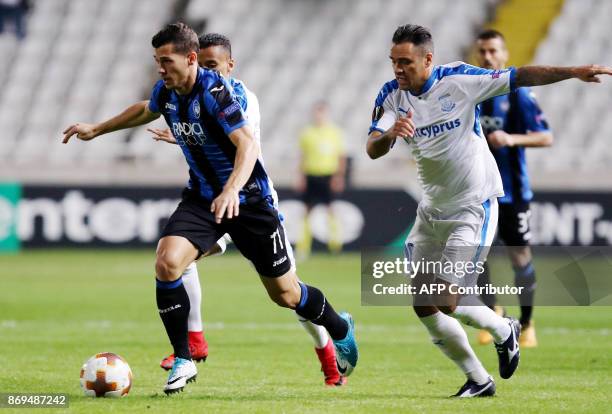 Atalanta's Remo Freuler vies for the ball against Apollon's Alex during the UEFA Europa League football match Apollon Limassol versus Atalanta...