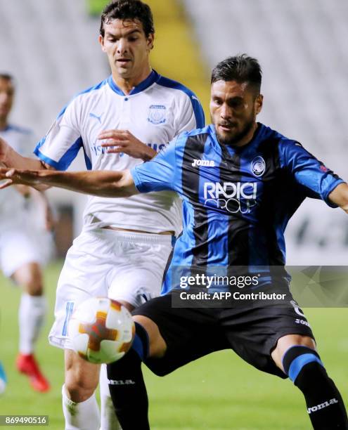 Atalanta's Jose Luis Palomino vies for the ball against Apollon's Emilio Zalaya during the UEFA Europa League football match Apollon Limassol versus...