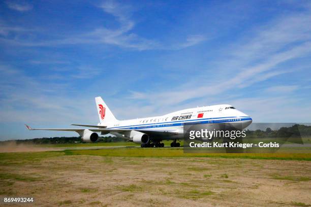 The Air China Boeing 747 carrying Chinese President Xi Jinping arrives at Hamburg Airport for the Hamburg G20 economic summit on July 6, 2017 in...