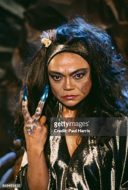 Eartha Kitt gives the V sign with her fingers and nail extensions on a movie set in Los Angeles December 14 Hollywood, California