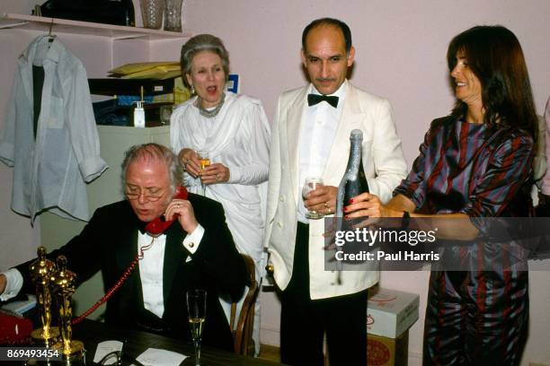 Richard Attenborough makes a phone call to friends back home in the UK in a back room at the Kate Mantalini restaurant, Beverly Hills, after the...