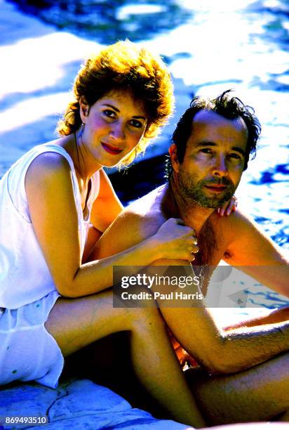 Herb Alpert 47 founder of the Tijuana Brass and A&M records with his wife Lani in the pool of the Malibu home he has lived in since 1974 which is on...