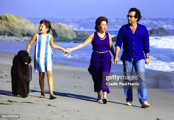Herb Alpert , his wife Lani and daughter Aria stroll on the beach beneath his Malibu home they have lived in since 1974 which is on a cliff...