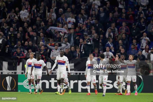 Memphis Depay of Lyon celebrates scoring his sides third goal with his Lyon team mates during the UEFA Europa League group E match between Olympique...
