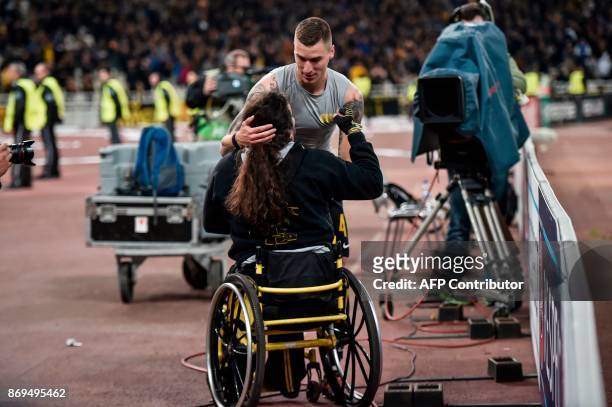 S Ognjen Vranjes thanks a fan after the UEFA Europa League Group D football match between AEK Athens and AC Milan at the OAKA stadium in Athens on...