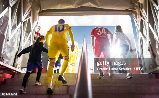 Mirko Ivanic of Borisov and Konstantin Rausch of Koeln walk on to the pitch throw the player tunnel prior to the UEFA Europa League group H match...