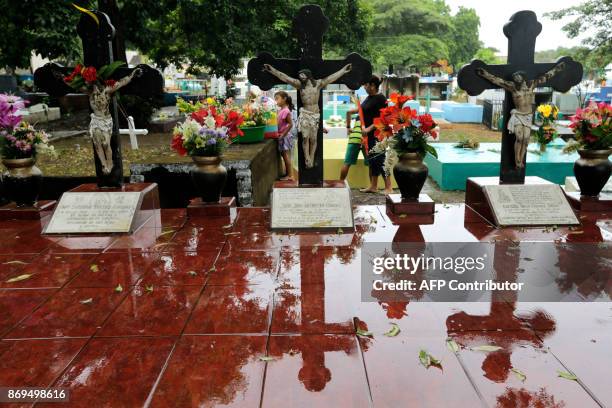 People visit the graves of their loved ones on the "Day of the Dead" in the cemetery of San Juan del Sur, Rivas, Nicaragua, 130 km from Managua, on...