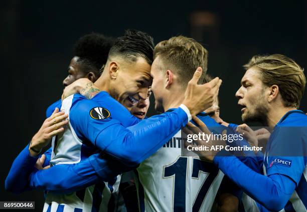 Hertha Berlin's forward Davie Selke celebrates with teammates after scoring the opening goal during the UEFA Europa League football match between...