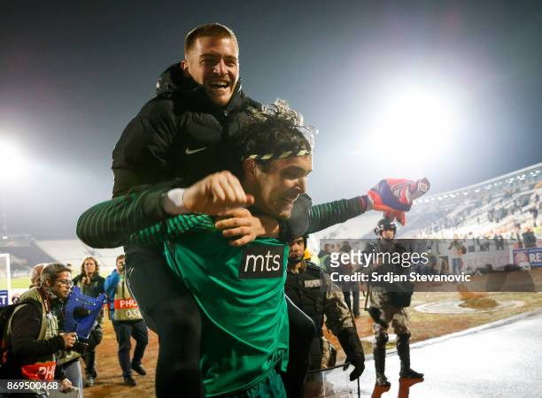 Goalkeeper Vladimir Stojkovic and Ognjen Ozegovic of Partizan celebrate victory after the UEFA Europa League group B match between Partizan and KF...