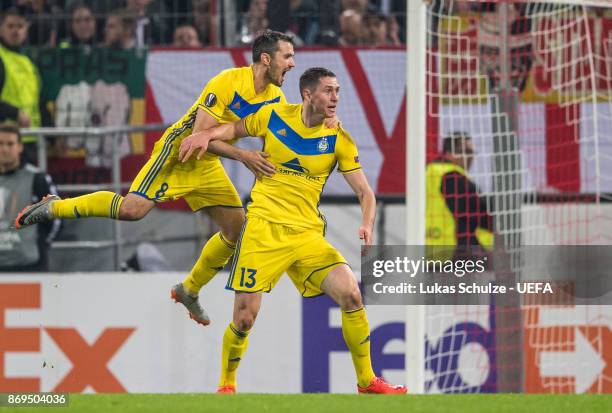 Scorer Nikolai Signevich of Borisov celebrates his teams second goal with Aleksandr Volodko of Borisov during the UEFA Europa League group H match...