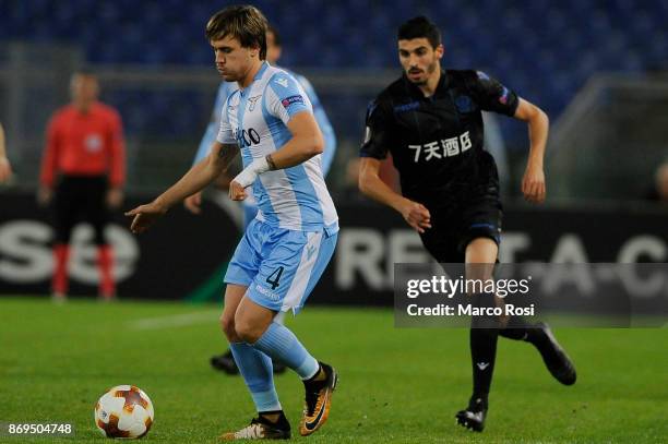 Patricio Gil Gabrron of SS Lazio compete for the ball with Pierre Lees-Melou of OGC Nice during the UEFA Europa League group K match between Lazio...