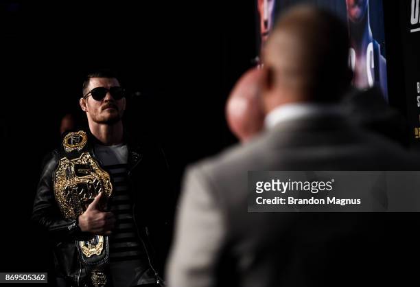 Middleweight champion Michael Bisping of England and Georges St-Pierre of Canada face off during the UFC 217 Press Conference inside Madison Square...