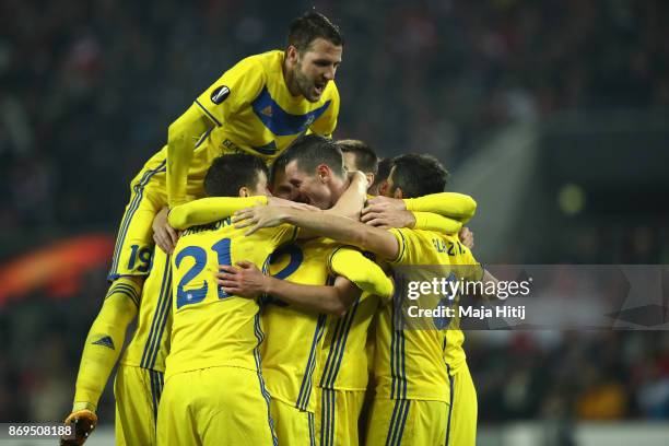 Nikolai Signevich of FC Bate Borisov celebrates with teammates after scoring his sides second goal during the UEFA Europa League group H match...