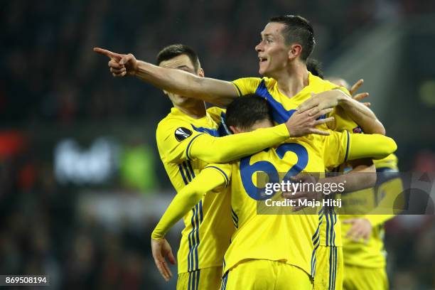 Nikolai Signevich of FC Bate Borisov celebrates with teammates after scoring his sides second goal during the UEFA Europa League group H match...