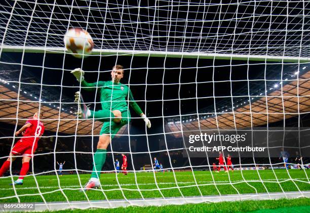 Zorya's goalkeeper Andriy Lunin kicks the ball in frustration after failing to save a goal by Hertha Berlin's forward Davie Selke during the UEFA...