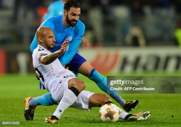 Vitoria Guimaraes' Brazilian forward Rafael Martins challenges Marseille's French defender Adil Rami during the UEFA Europa League group I football...
