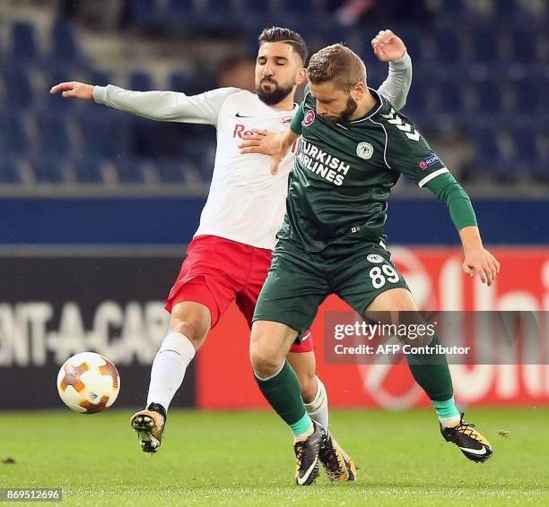 Salzburg's midfielder from Israel Moanes Dabour and Konyaspor's defender from Slovenia Nejc Skubic vie for the ball during the UEFA Europa League...