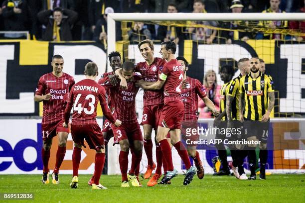 Zulte Waregem 's Marvin Baudry celebrates with teammates afetr scoring a goal during the UEFA Europa League Group K football match between Vitesse...