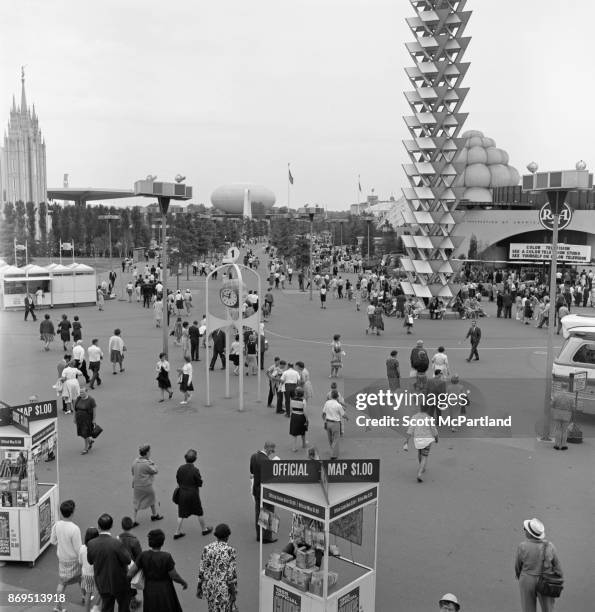 Elevated view of the RCA Pavilion, IBM Pavilion, and park goers at the 1964-65 World's Fair in Flushing Meadows Corona Park, New York, New York, June...