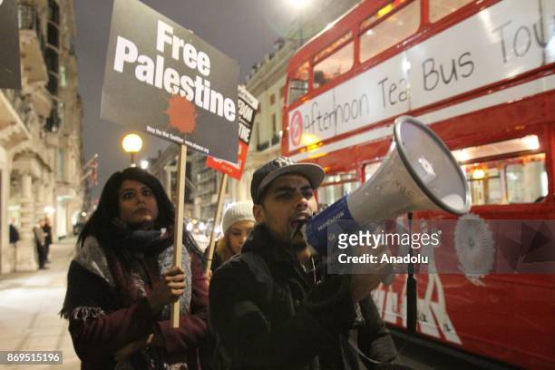 People stage a protest against the 100th anniversary of the Balfour Declaration in front of the Lancaster House in London, United Kingdom November 2,...