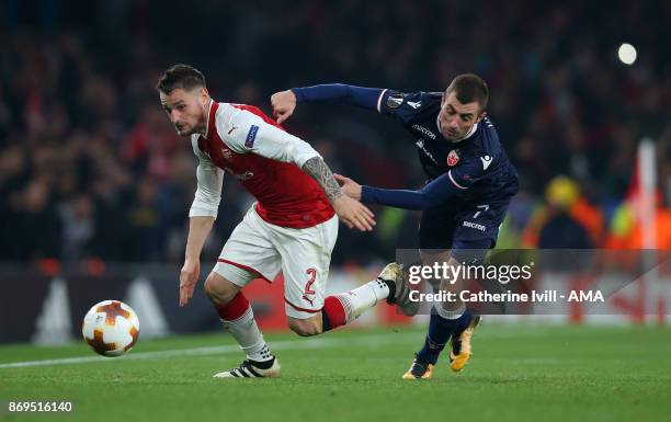 Mathieu Debuchy of Arsenal and Nenad Krsticic of Red Star Belgrade during the UEFA Europa League group H match between Arsenal FC and Crvena Zvezda...