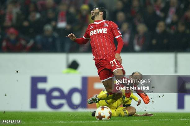 Igor Stasevich of FC Bate Borisov tackles Leonardo Jesus Bittencourt of FC Koeln during the UEFA Europa League group H match between 1. FC Koeln and...