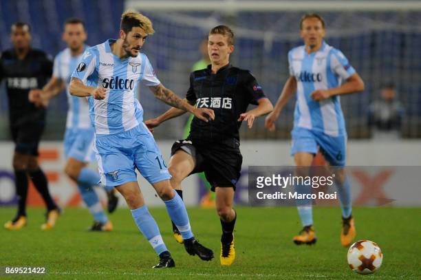 Luiz Luis Alberto of SS Lazio compete for the ball with Vincent Koziello of OGC Nice during the UEFA Europa League group K match between Lazio Roma...