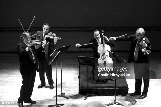 From left, Philip Setzer, Eugene Drucker, David Finckel and Lawrence Dutton of Emerson String Quartet performing Schubert's "String Quartet in A...