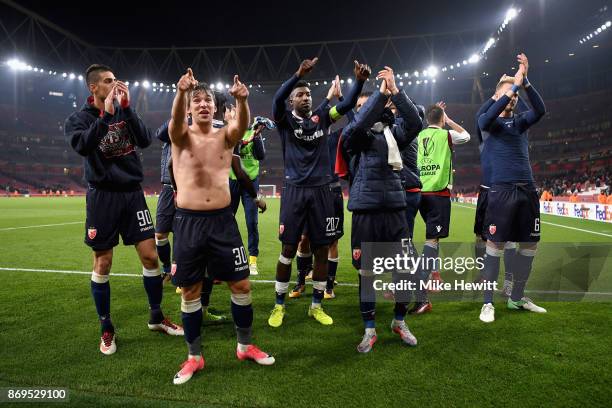 Filip Stojkovic of FK Crvena Zvezda and his FK Crvena Zvezda team mates celebrate after the UEFA Europa League group H match between Arsenal FC and...