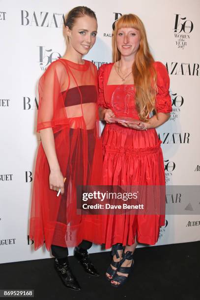 Edie Campbell and Molly Goddard, winner of the Breakthrough Designer Award, attend Harper's Bazaar Women of the Year Awards in association with Ralph...