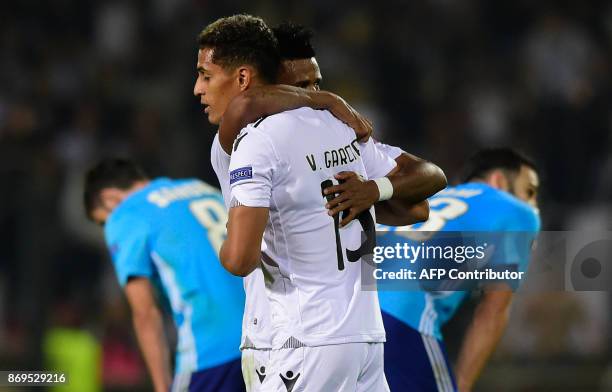 Vitoria Guimaraes' Venezuelan defender Victor Garcia and teammate forward Heldon celebrate at the end of the UEFA Europa League group I football...