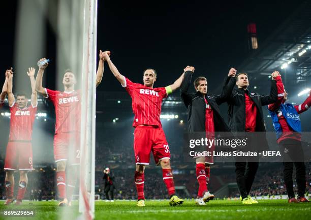 Matthias Lehmann of Koeln and team mates celebrate after winning the UEFA Europa League group H match between 1. FC Koeln and BATE Borisov at...