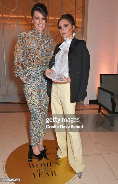 Suranne Jones and Victoria Beckham, winner of the British Brand of the Year award, attends Harper's Bazaar Women of the Year Awards in association...