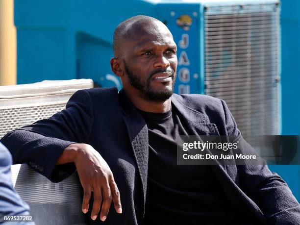 Former Wide Receiver Great Isaac Bruce of the Los Angeles Rams on the sidelines during the game against the Jacksonville Jaguars at EverBank Field on...