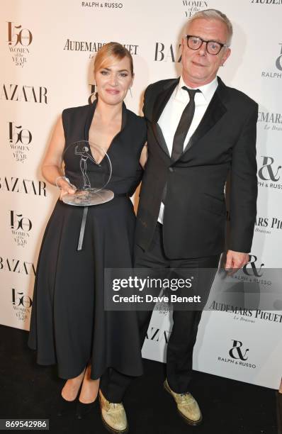 Kate Winslet, winner of the British Actress of the Year award, and Stephen Daldry attend Harper's Bazaar Women of the Year Awards in association with...