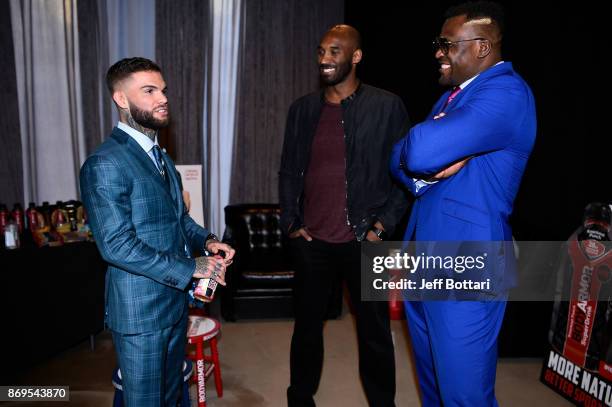 Bantamweight Champion Cody Garbandt, BodyArmor investor Kobe Bryant and UFC heavyweight Francis Ngannou interact backstage during the UFC BodyArmor...