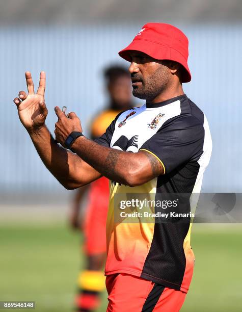 Coach Michael Marum talks tactics with his players during a Papua New Guinea Kumuls Rugby League World Cup training session at the Oil Search...