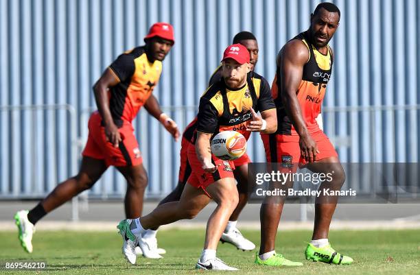 Kurt Baptise passes the ball during a Papua New Guinea Kumuls Rugby League World Cup training session at the Oil Search National Football Stadium on...