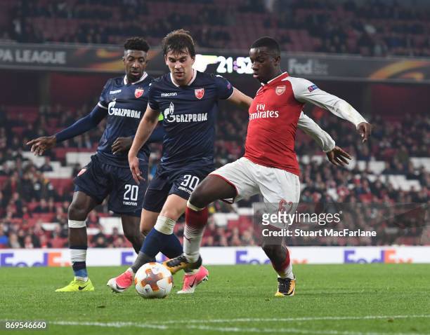 Eddie Nketiah of Arsenal challenged Filip Stojkovic of Red Red Star during the UEFA Europa League group H match between Arsenal FC and Crvena Zvezda...