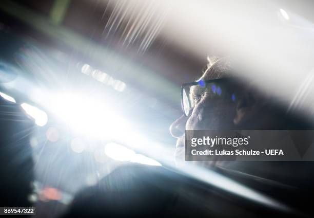Head Coach Peter Stoeger of Koeln is seen through glass prior to the UEFA Europa League group H match between 1. FC Koeln and BATE Borisov at...